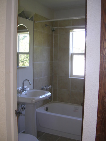 607 Elmhurst Road Mount Prospect, IL 60056 - Photo 9 of 24 a bathroom with a sink a toilet and shower
