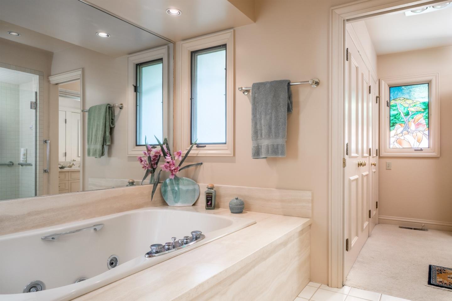 3011 Cormorant Road Pebble Beach, CA 93953 - Photo 24 of 37 a bathroom with a bathtub sink and mirror