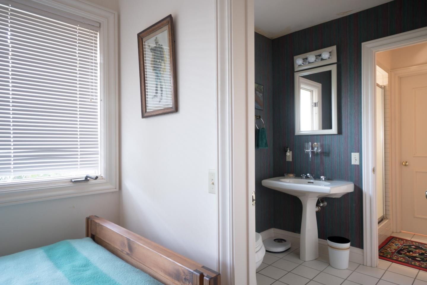 3011 Cormorant Road Pebble Beach, CA 93953 - Photo 26 of 37 a bathroom with a sink and a mirror