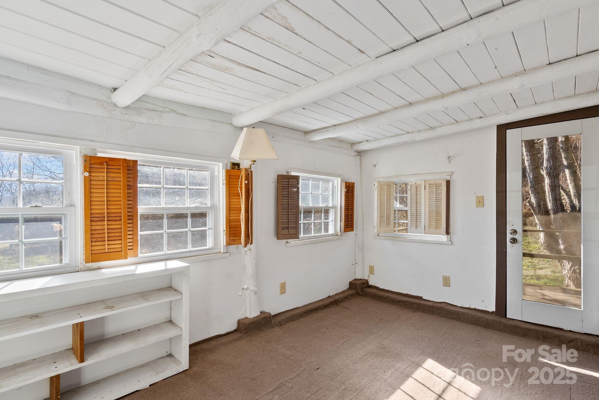 849 South Ammons Branch Road Marshall, NC 28753 - Photo 11 of 20 a view of an empty room with a window