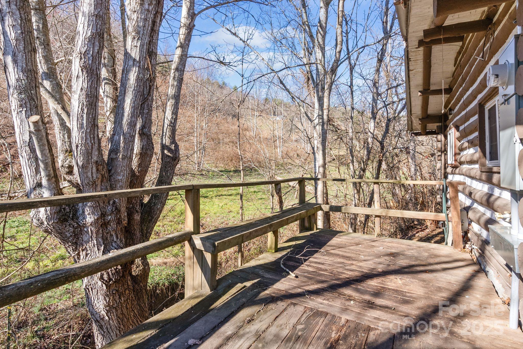 849 South Ammons Branch Road Marshall, NC 28753 - Photo 15 of 20 a view of balcony with wooden floor and fence
