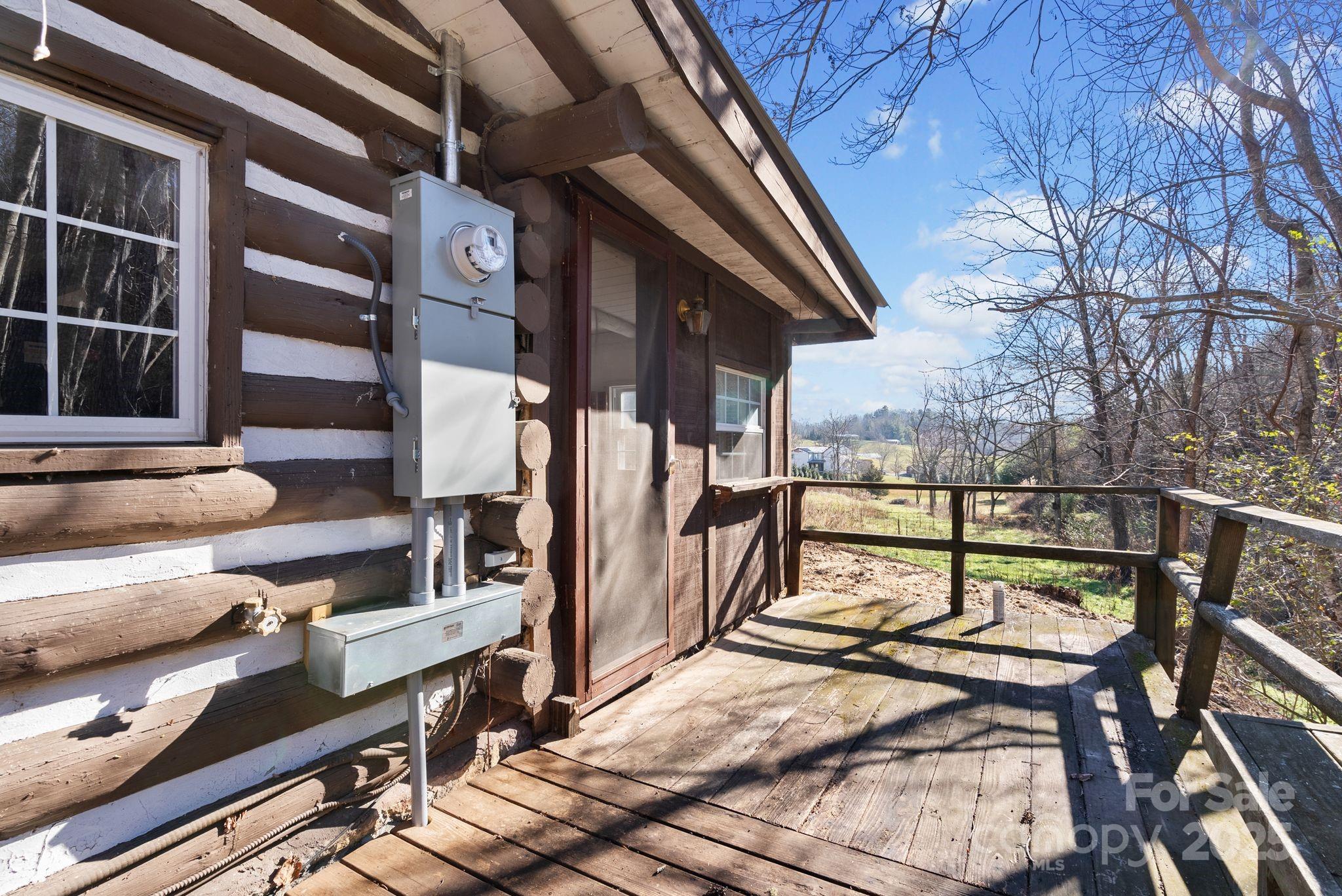 849 South Ammons Branch Road Marshall, NC 28753 - Photo 16 of 20 a view of balcony with wooden floor and outdoor seating