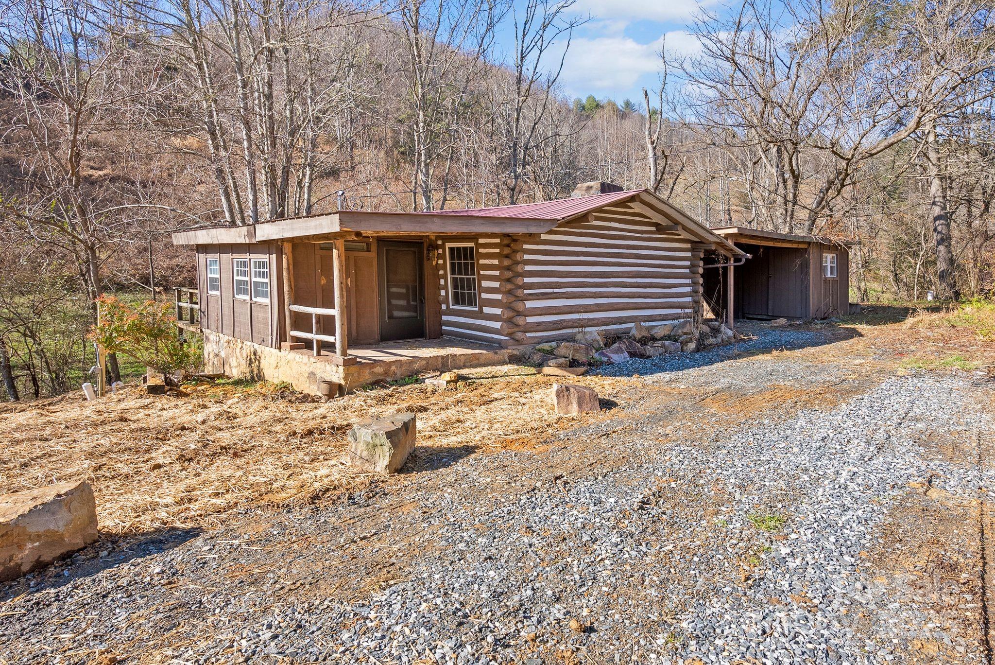 849 South Ammons Branch Road Marshall, NC 28753 - Photo 3 of 20 a view of a house with a yard covered in snow
