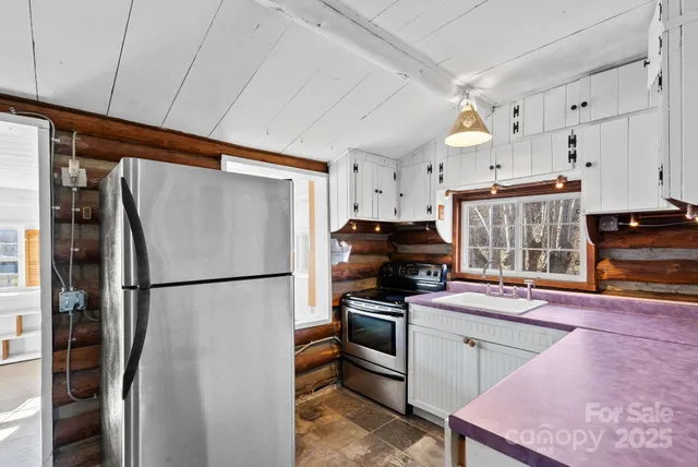 a white refrigerator freezer sitting in a kitchen