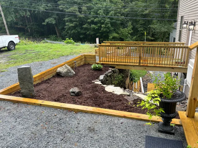 a view of a garden with sitting area