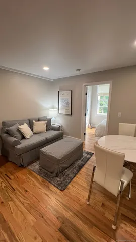 a bedroom with two beds and a couch