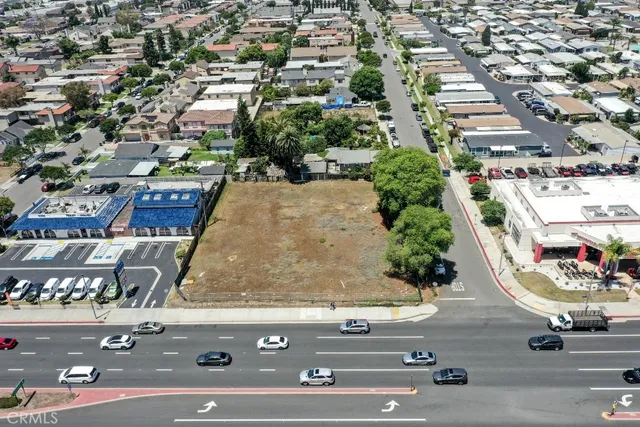 an aerial view of residential houses and car parked on street side