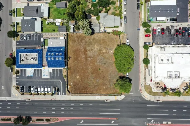 an aerial view of a residential apartment building with a yard