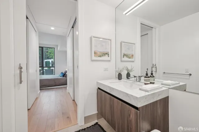 a en suite bathroom with a sink and a mirror