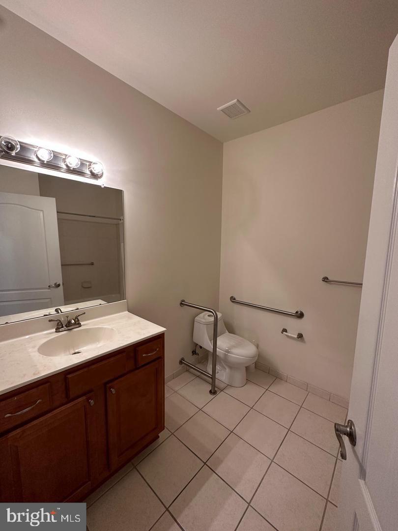 1630 Welsh Road, Unit 3A Philadelphia, PA 19115 - Photo 8 of 14 a bathroom with a sink vanity and mirror