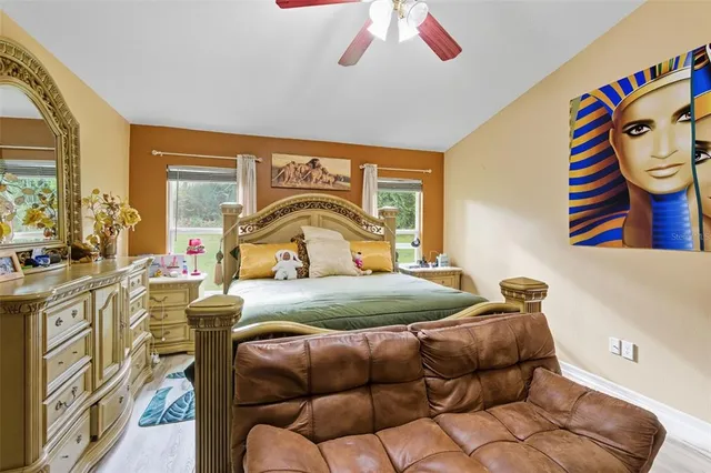 a bedroom with bed and window