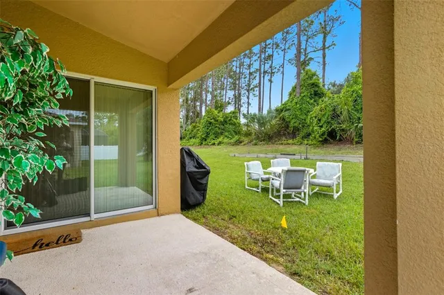 a view of a front of a house with a yard