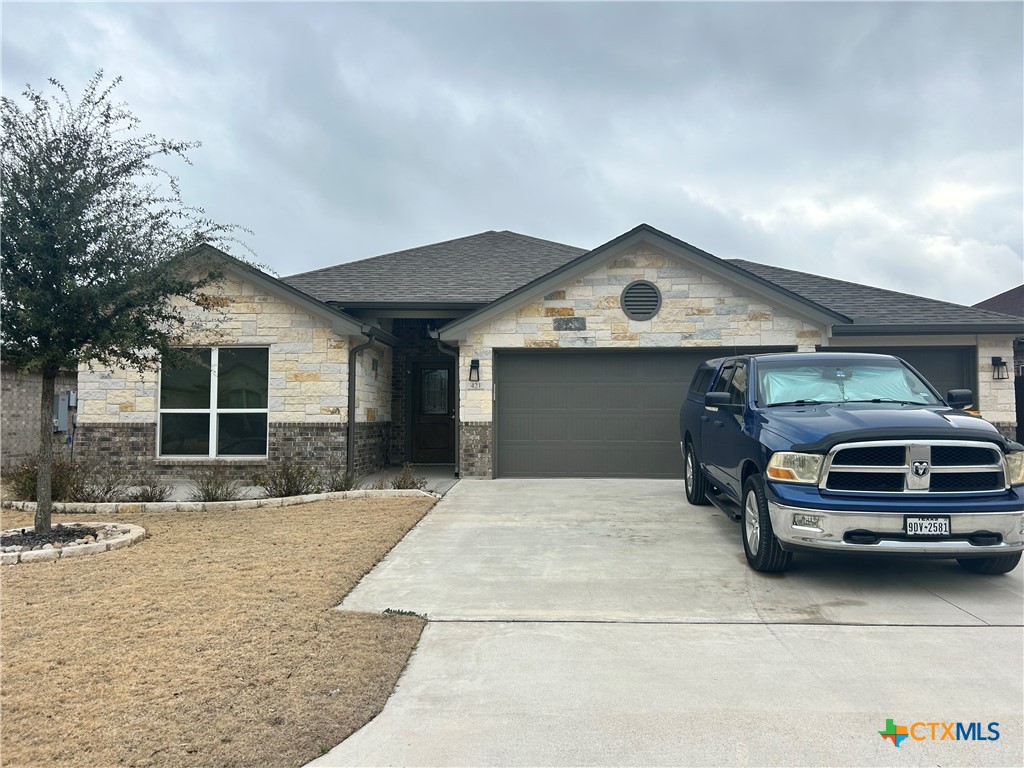 a front view of a house with parking space