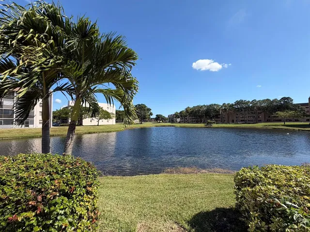 a view of a lake with a yard
