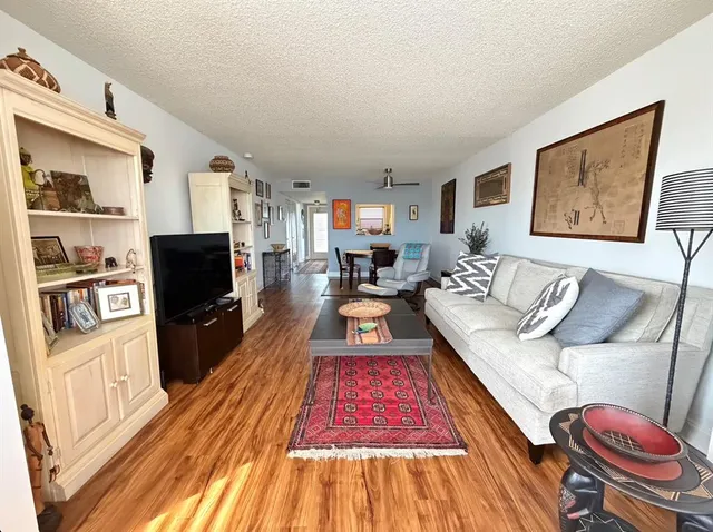 a living room with furniture fireplace and flat screen tv