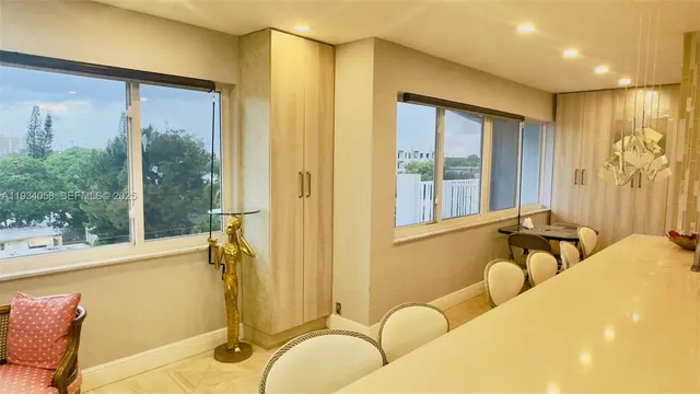 a bedroom with a bed and glass windows