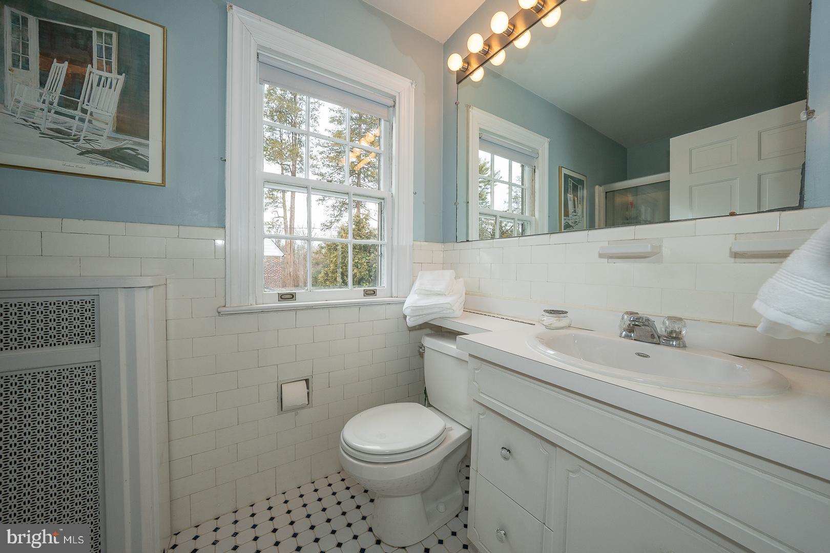 547 St Davids Avenue Wayne, PA 19087 - Photo 20 of 31 a bathroom with a toilet a sink and a window