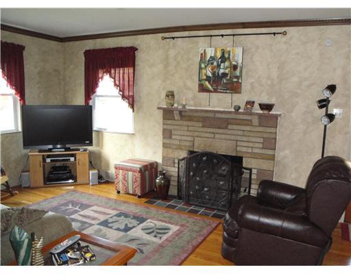 2502 Wigwam Road Aliquippa, PA 15001 - Photo 2 of 18 Living Room. The Living Room is cozy yet spacious and boasts a gas fireplace as the focal point. Decorative yet neutral walls and gleaming hardwood floors.
