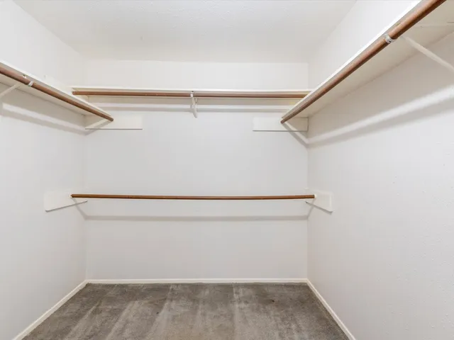 a view of an empty walk in closet