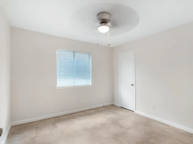 an empty room with a empty space and a window