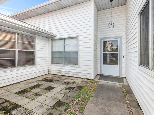 a view of house with backyard