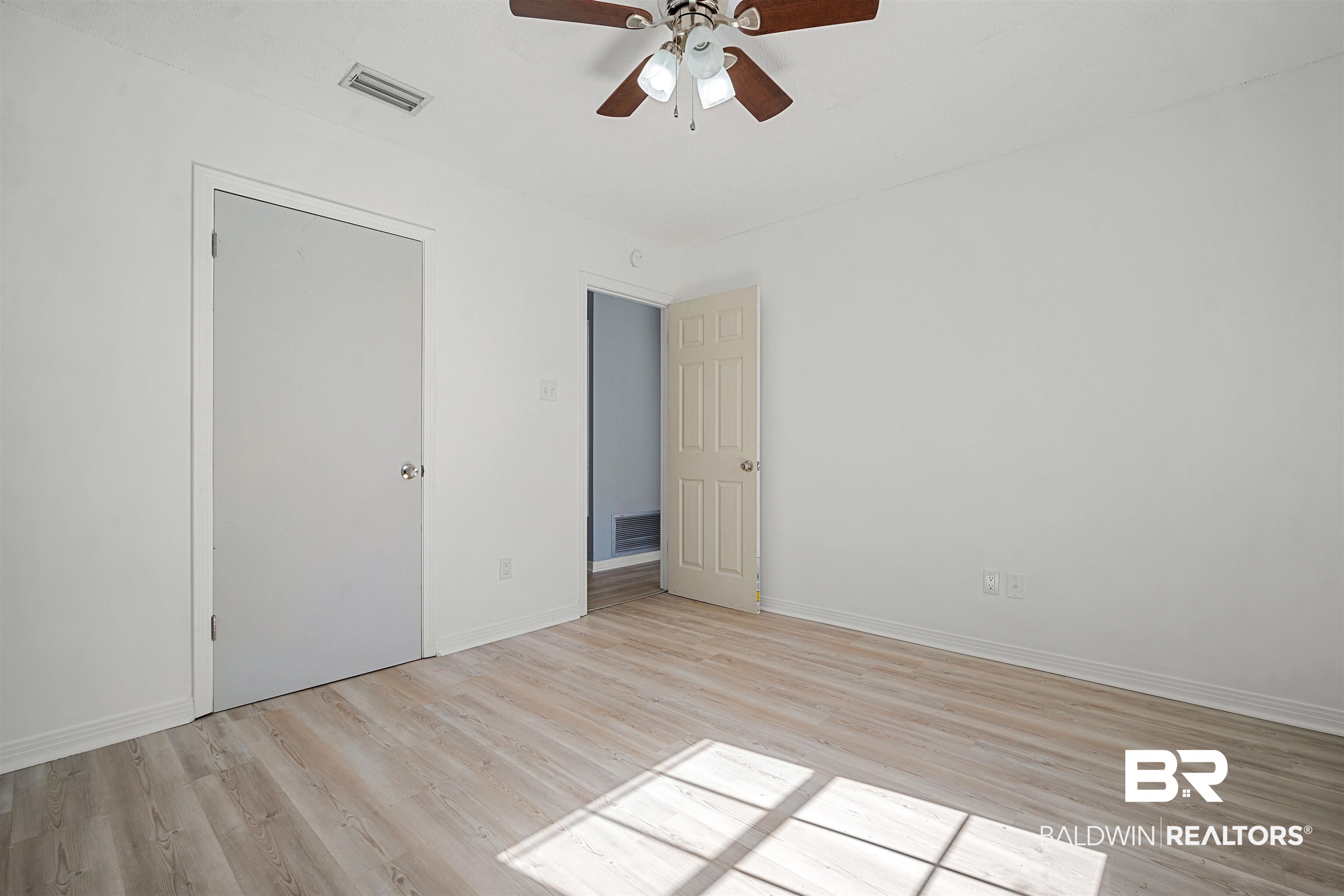 12910 Del Rio Street Grand Bay, AL 36541 - Photo 21 of 26 Unfurnished bedroom featuring light wood-style floors and a ceiling fan