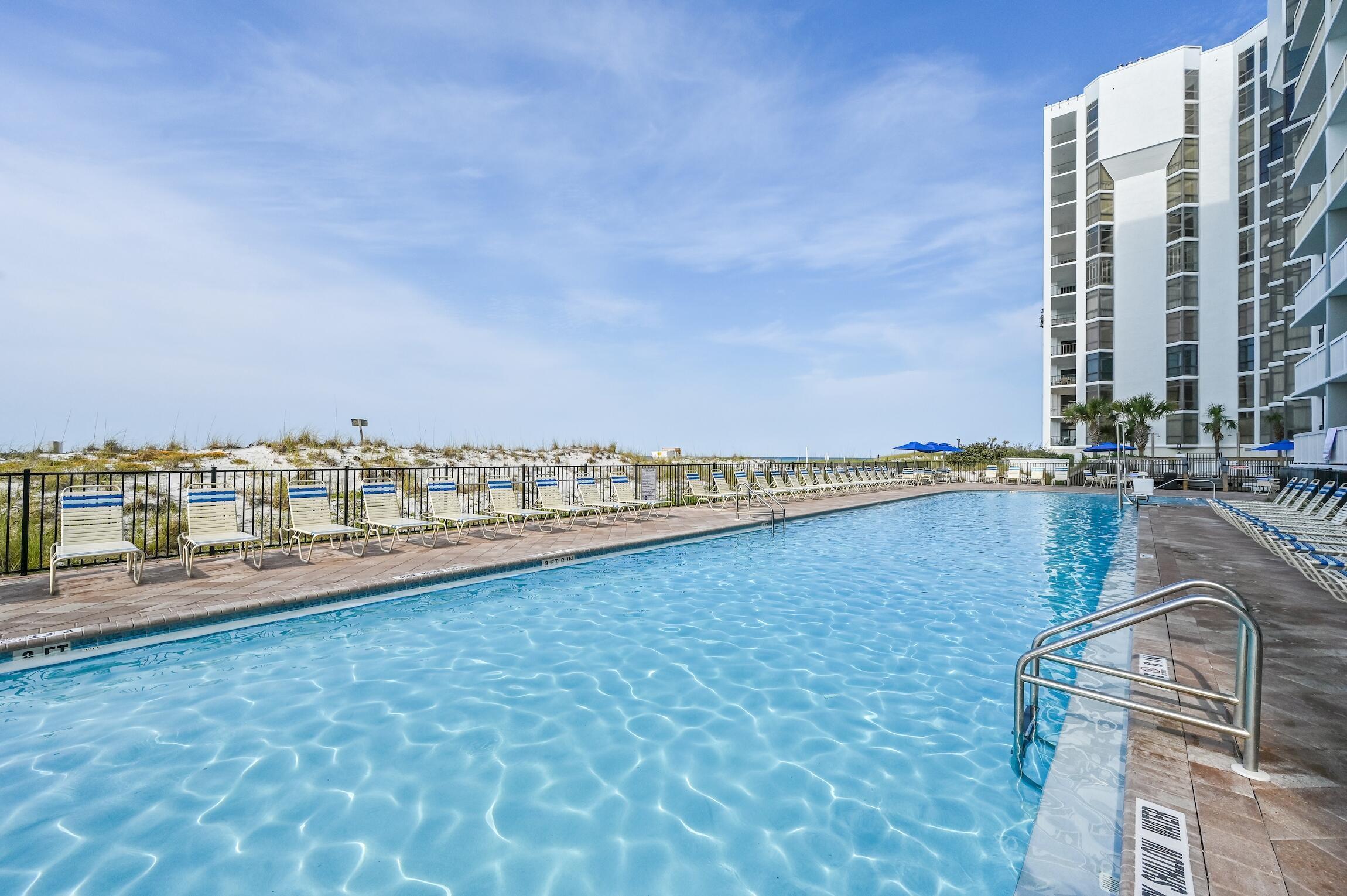 970 Highway 98, Unit 303 Destin, FL 32541 - Photo 15 of 42 a view of a swimming pool and an outdoor seating