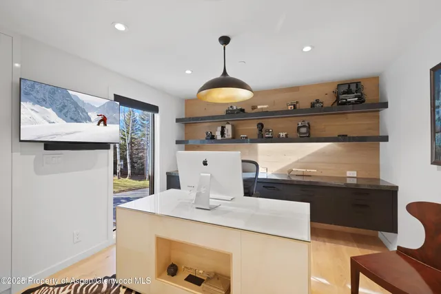 a kitchen with a table and chairs