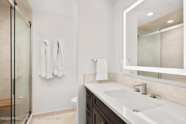 a bathroom with a sink vanity and a mirror
