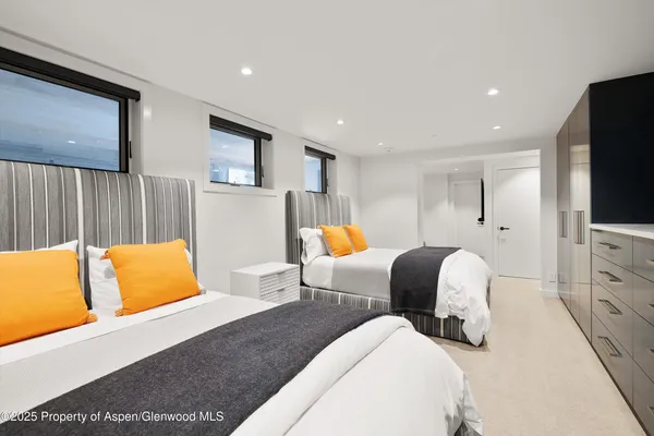 a bedroom with furniture and a flat screen tv