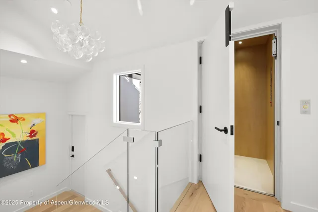 a view of a house with a wooden fence