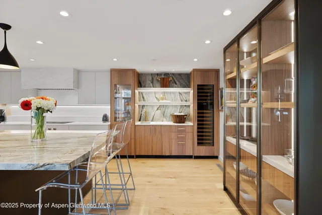 a view of kitchen with refrigerator and window