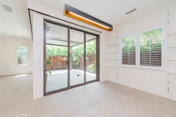 a view of an empty room with a balcony