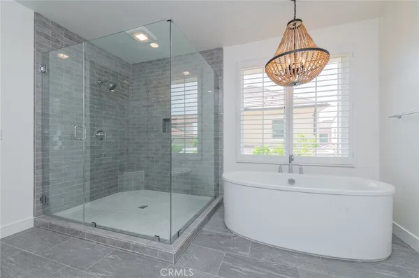 a bathroom with a bathtub and shower