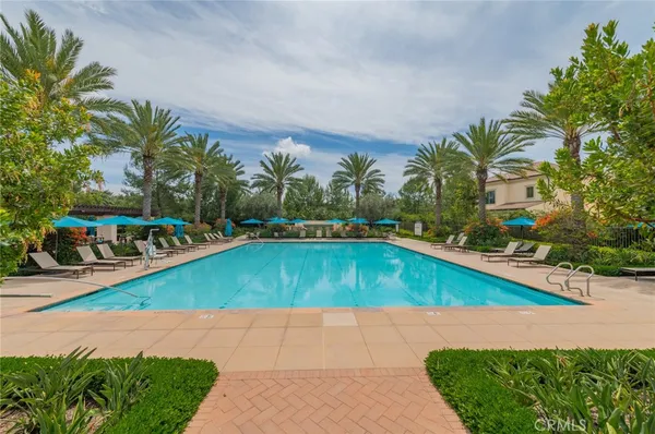 a view of a swimming pool with lounge chair