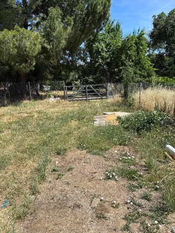 a view of backyard with outdoor space