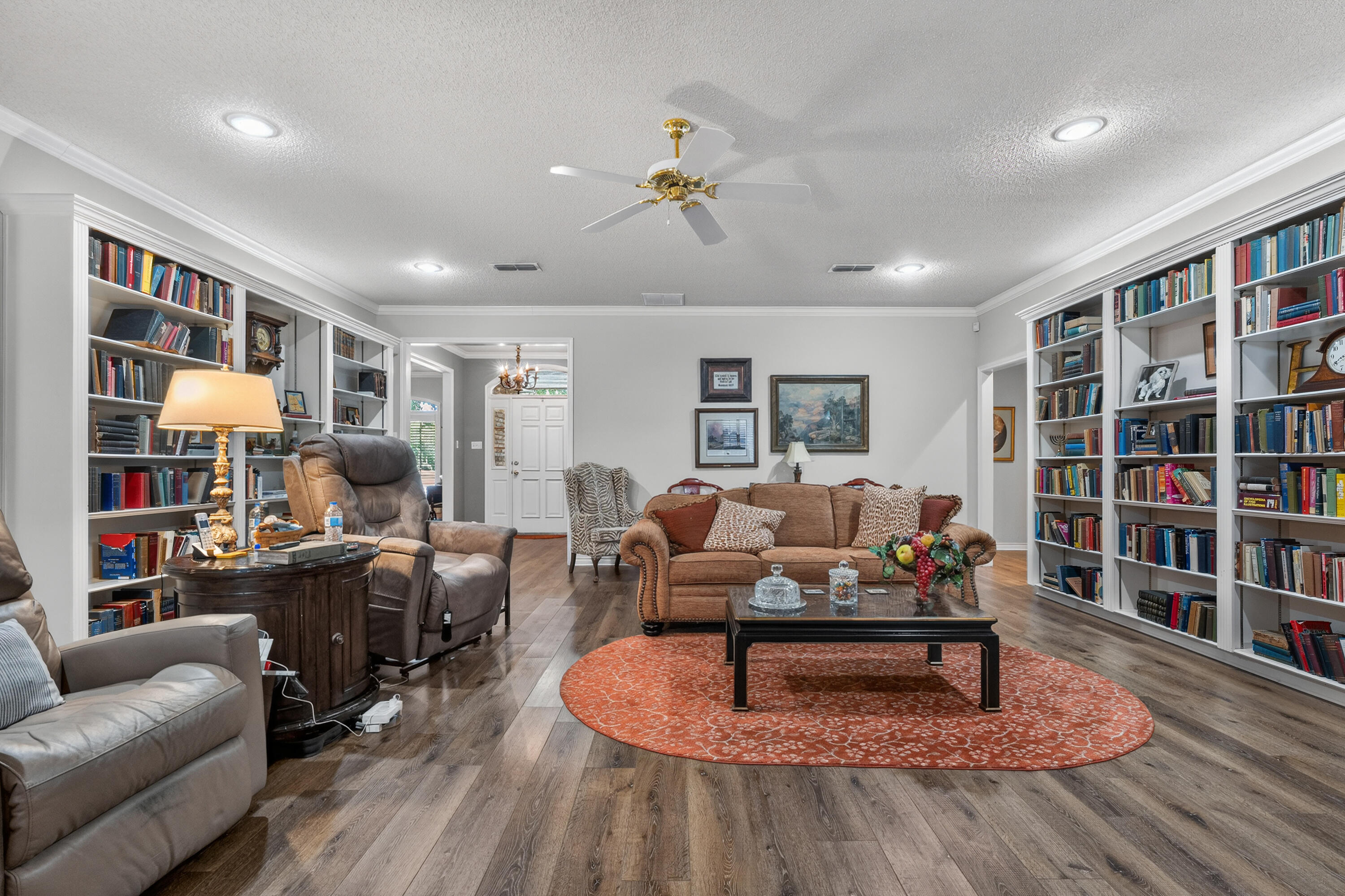 7402 95th Street Lubbock, TX 79424 - Photo 7 of 43 a living room with furniture and a book shelf