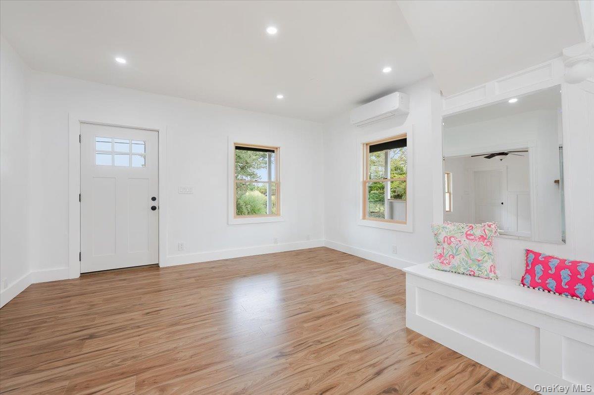 56 Oak Beach Road Babylon, NY 11702 - Photo 8 of 30 Luxury vinyl flooring, abundant natural light and new Anderson windows.