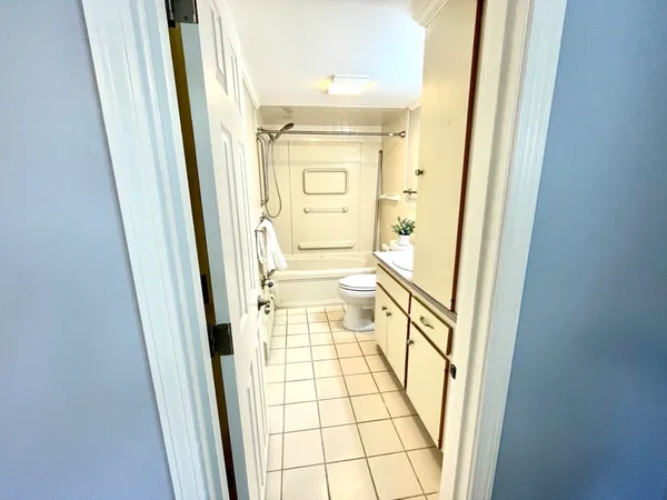 an empty room with a empty space and windows
