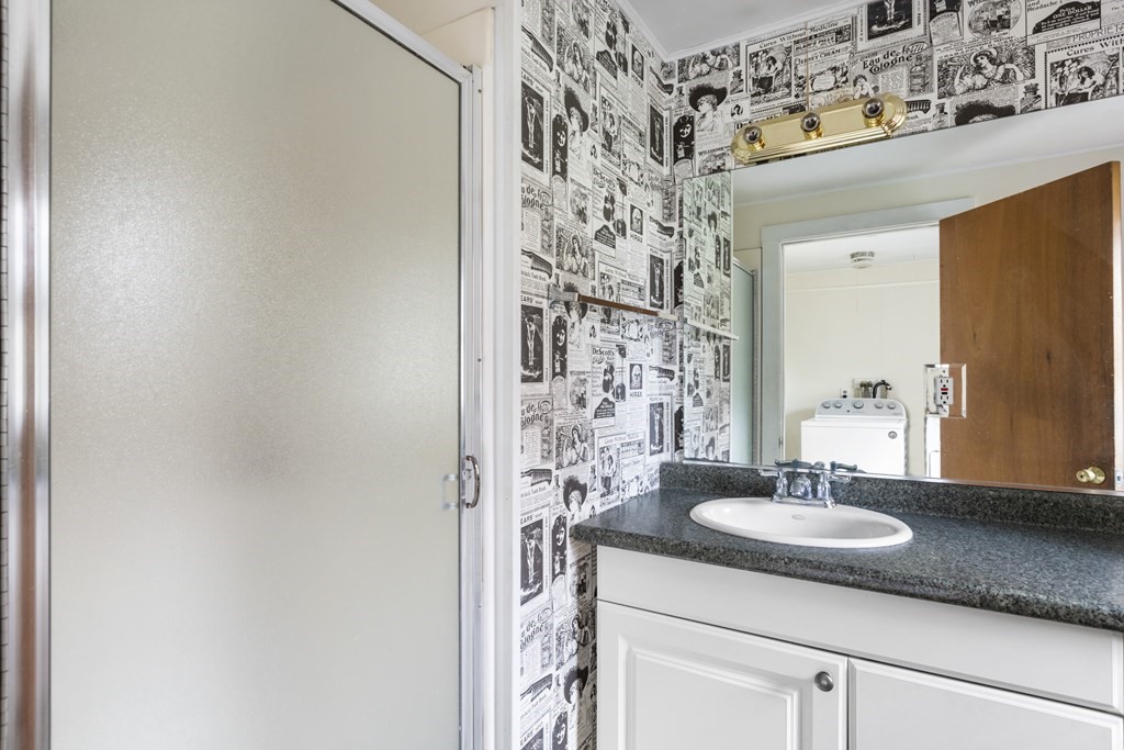 103 Myrtle Street Ashland, MA 01721 - Photo 16 of 38 a sink and a mirror