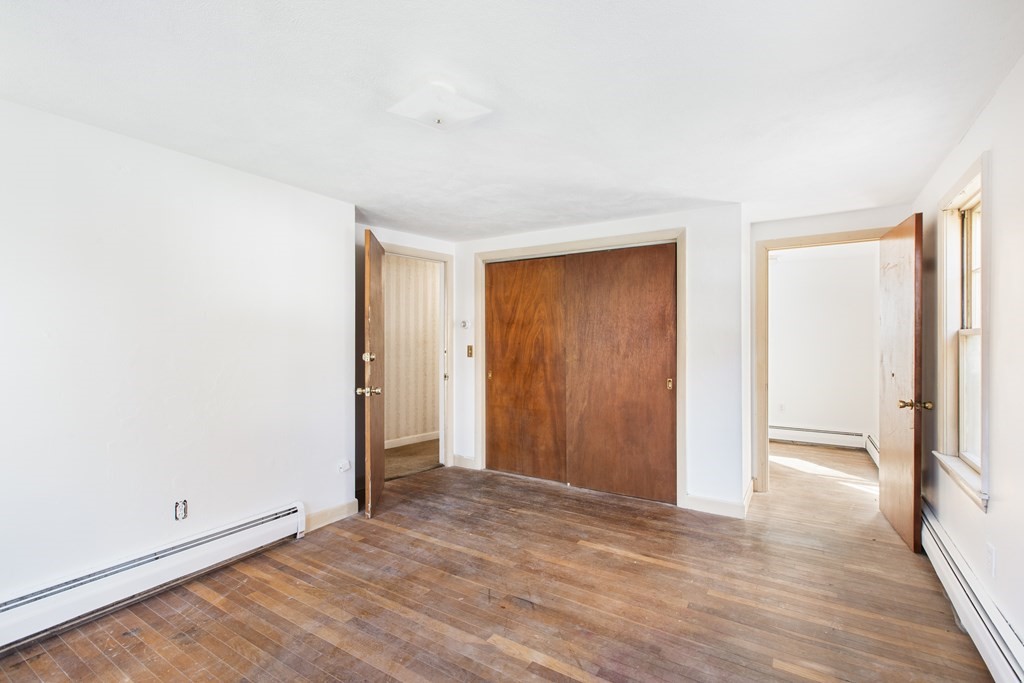 103 Myrtle Street Ashland, MA 01721 - Photo 17 of 38 an empty room with wooden floor and windows