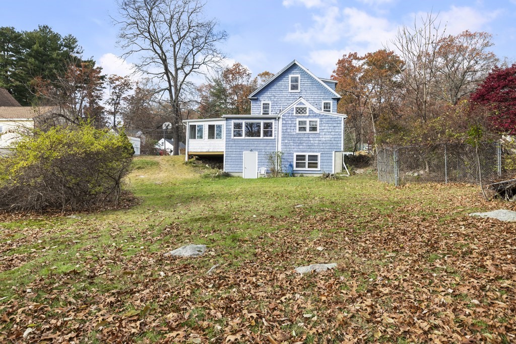 103 Myrtle Street Ashland, MA 01721 - Photo 33 of 38 a front view of a house with a yard