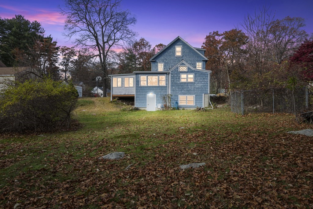 103 Myrtle Street Ashland, MA 01721 - Photo 34 of 38 a view of a brick house with a big yard and large trees