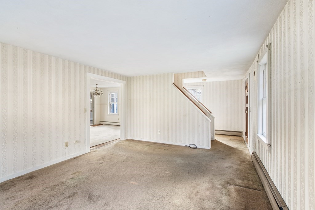 103 Myrtle Street Ashland, MA 01721 - Photo 4 of 38 a view of an empty room with a window