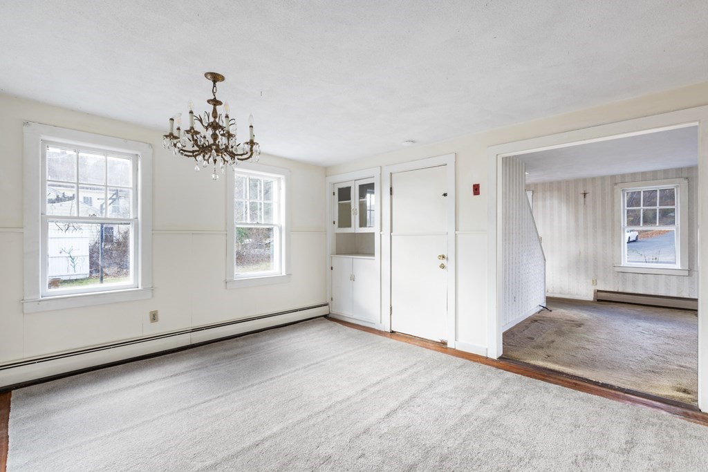 103 Myrtle Street Ashland, MA 01721 - Photo 7 of 38 an empty room with windows and entrance