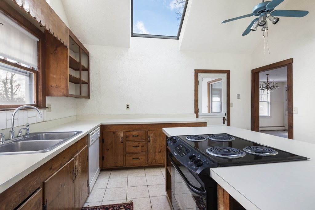 103 Myrtle Street Ashland, MA 01721 - Photo 10 of 38 a kitchen with a sink stove and cabinets