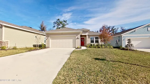 a very nice looking house with a large window