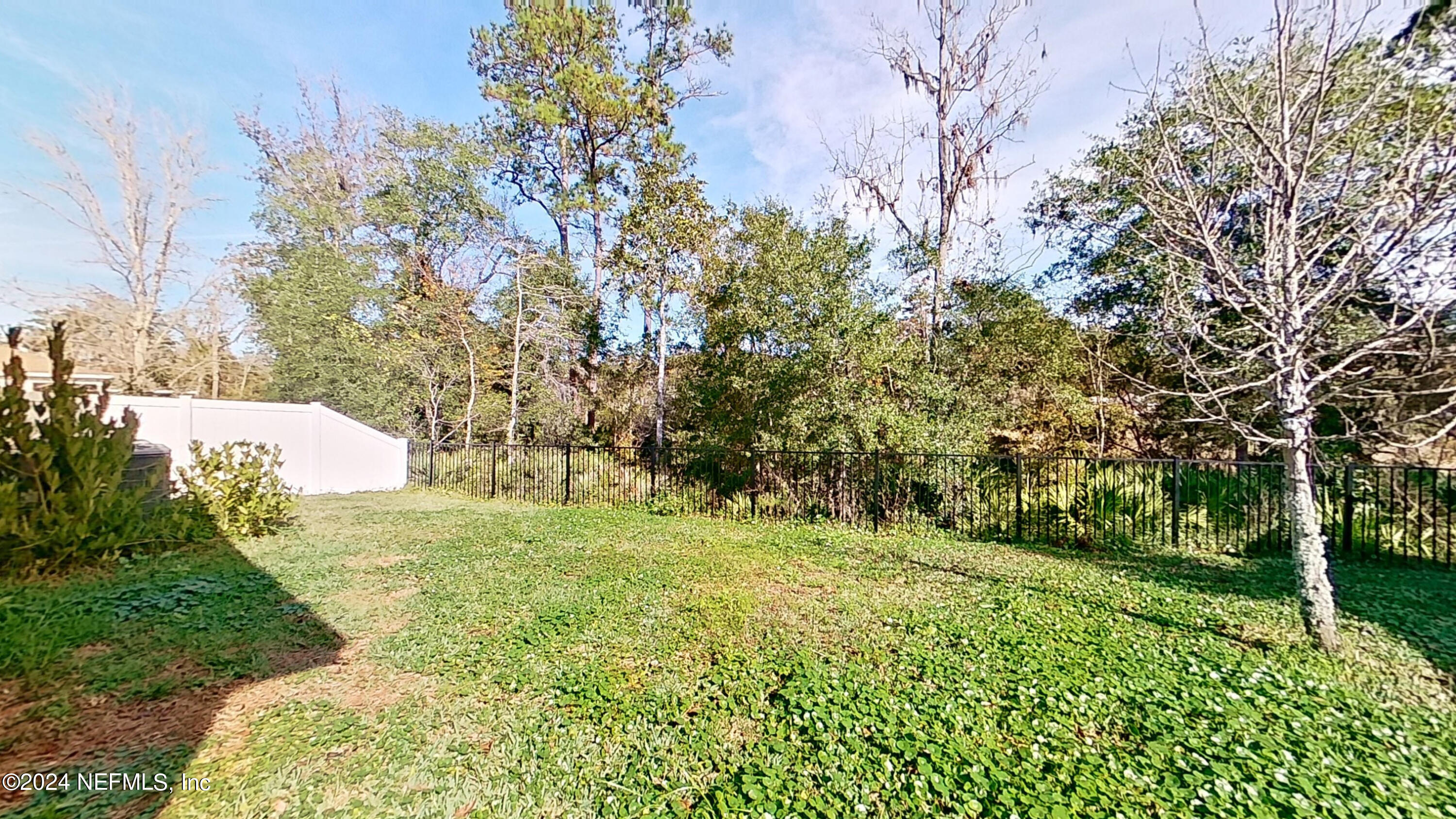 10887 Ventnor Avenue Jacksonville, FL 32218 - Photo 19 of 19 a big yard with lots of green space and trees