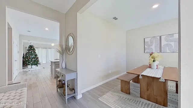 a view of dining room and wooden floor