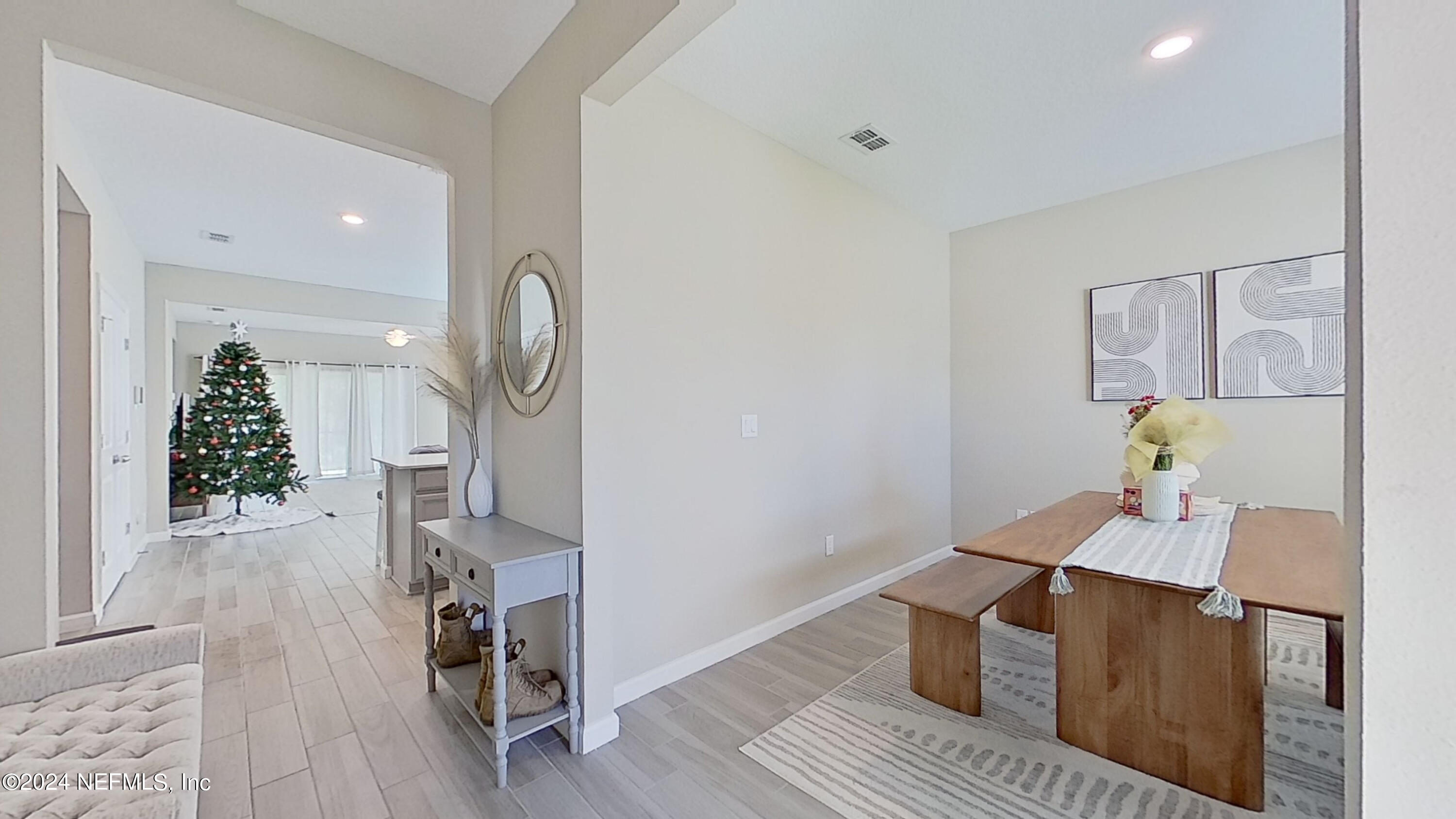 10887 Ventnor Avenue Jacksonville, FL 32218 - Photo 3 of 19 a view of dining room and wooden floor